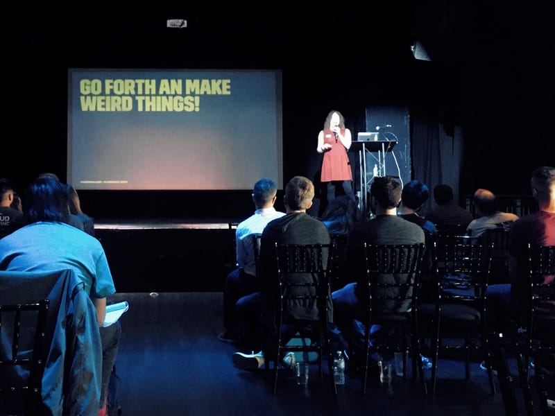 Em Lazer Walker at Flashback Conference 2020 in Orlando. Slide text reads, "Go forth and make weird things!"